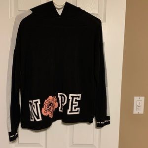 No boundaries shirt with hood. Says Nope on bottom front and on one shoulder.